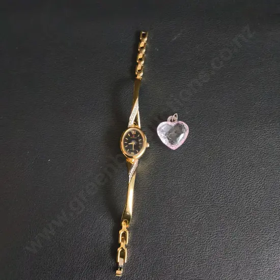 GOLD TONE OLYMPIC SWISS WATCH AND A HEART PENDANT