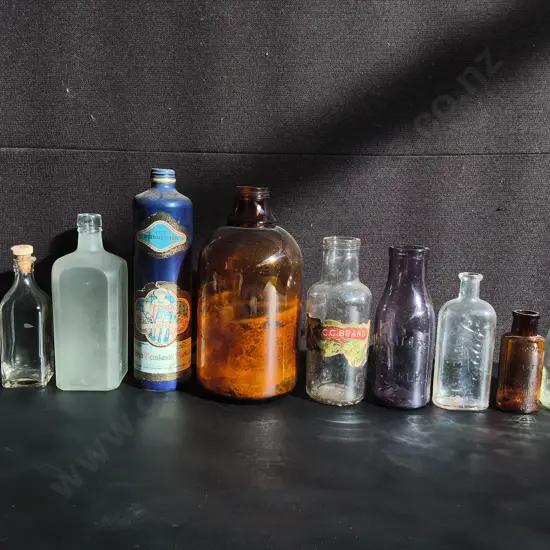 COLLECTION OF 10 VINTAGE CLEAR GLASS BOTTLES, TALLEST H 29
