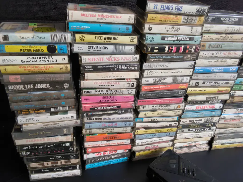 COLLECTION OF CASSETTES AND CASSETTE PLAYER Image 1++