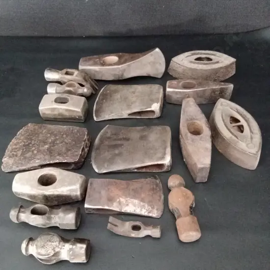 COLLECTION OF VINTAGE METAL TOOL HEADS AND CAST IRON ITEMS