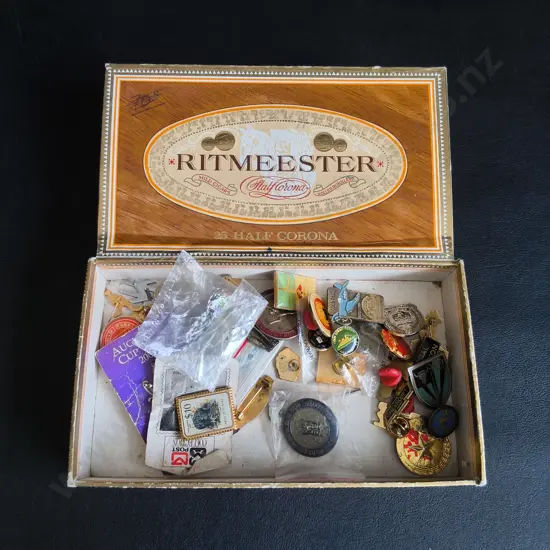 VINTAGE RITMEESTER CIGAR BOX FULL OF PINS AND BADGES