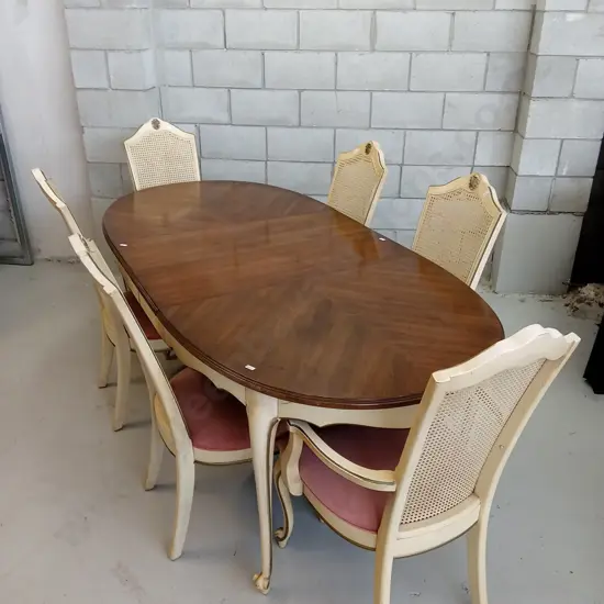 FRENCH PROVINCIAL-STYLE EXTENDABLE DINING TABLE WITH 6 CANE-BACK CUSHIONED CHAIRS,