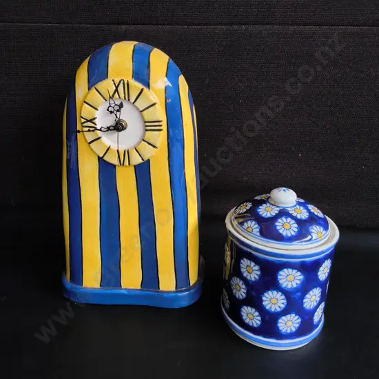 VINTAGE CERAMICS, HAND PAINTED STRIPED MANTLE CLOCK AND BLUE DAISY LIDDED JAR, TALLEST H 29 CM