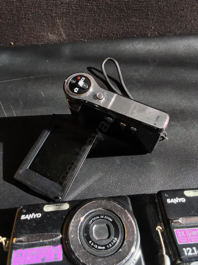3 DIGITAL CAMERAS, SONY, ANDXOAIR OF SANYO, UNTESTED Image 1++