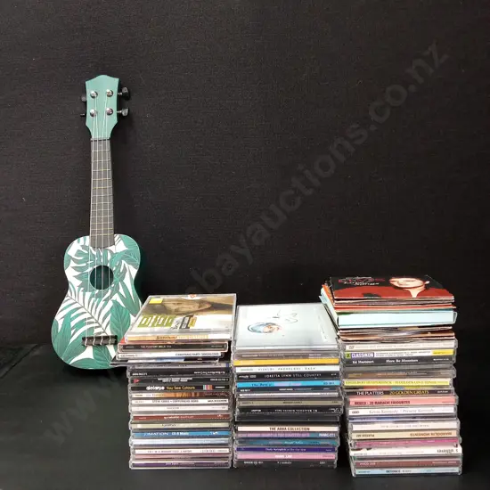 COLLECTION OF CDS AND A UKELELE