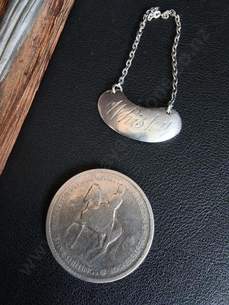 3 PIECES VINTAGE COLLECTORS ITEMS, RISEN CHRIST CRUCIFIX, SILVER PLATED DECANTER LABEL AND COMMEMORATIVE COIN Image 1++
