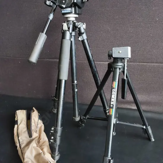 PAIR OF CAMERA TRIPODS, ONE WITH CASE, MANFROTTO AND LOMEX