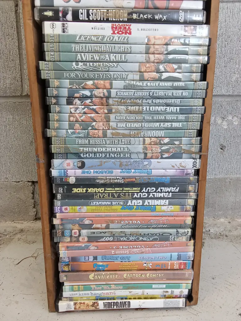 DVD CASE STAND WITH DVDS, H 100CM X W 22CM X D 14CM Image 1++