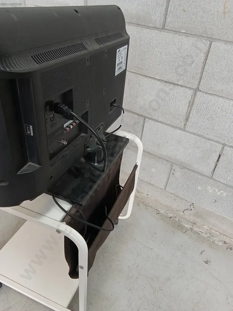 SAMSUNG TV STATION ON WHEELS, 26", INCLUDING WORKING DVD PLAYER AND CORD POUCH. Image 1++