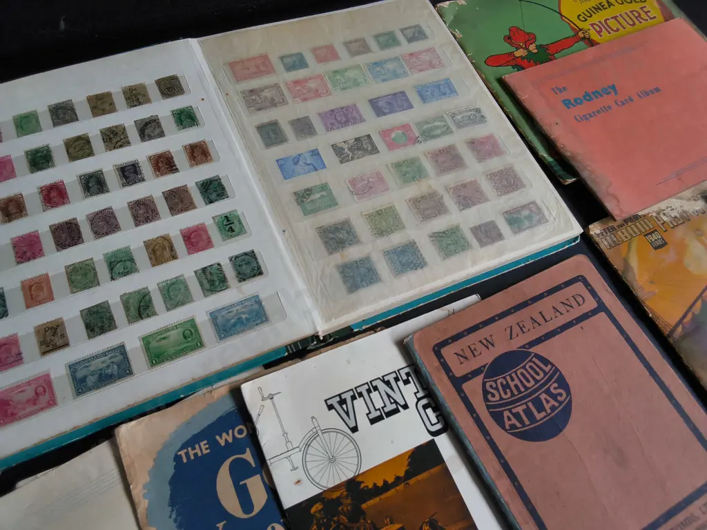 COLLECTION OF VINTAGE NZ AND BRITISH PRINTED EPHEMERA,  STAMP ALBUM, CIGARETTE CARD BOOKS, ETC Image 1++
