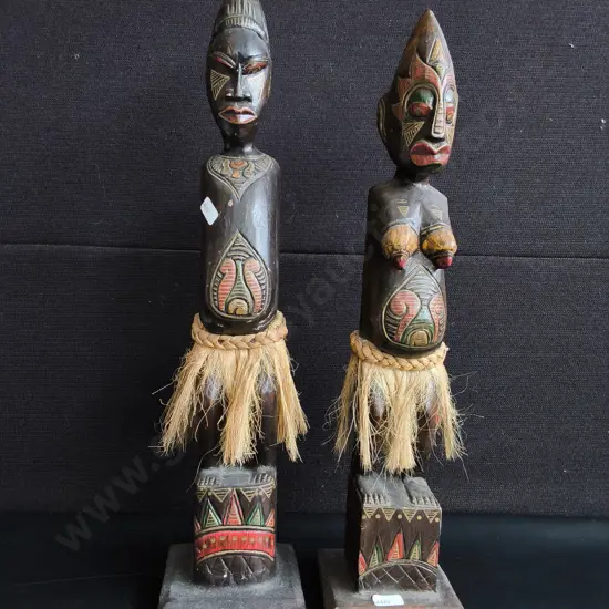 VINTAGE PAIR OF AFRICAN STYLE HAND CARVED WOOD TRIBAL STATUES, MALE AND FEMALE FOLK ART FIGURES WITH RAFFIA SKIRTS