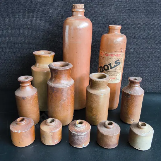 COLLECTION OF 12 ANTIQUE SALT GLAZED STONEWARE BOTTLES AND INKWELLS, TALLEST H 29 CM