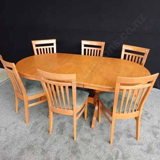 EXTENDABLE WOODEN TABLE AND 6 WOODEN CHAIRS WITH A GREEN CUSHION