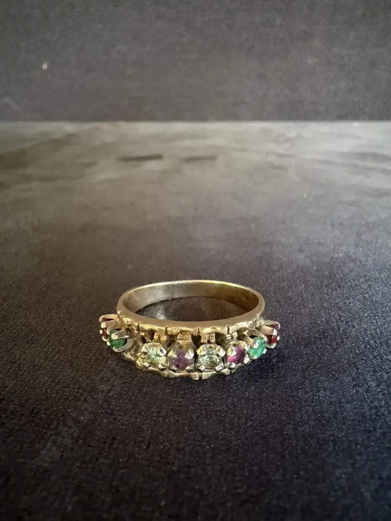 GOLD RING MARKED 10k WITH VARIOUS STONES INSET AND ONE STONE MISSING Image 1++