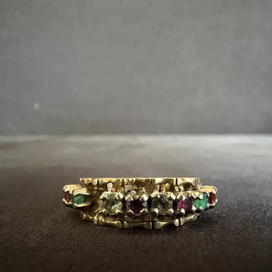 GOLD RING MARKED 10k WITH VARIOUS STONES INSET AND ONE STONE MISSING