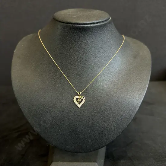 FINE GOLD CHANGE WITH I LOVE YOU HEART PENDANT MARKED 10K CONTAINING WHITE STONES TESTED AS DIAMONDS