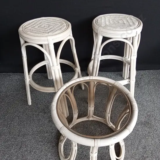 2 ROUND BAMBOO STOOLS AND CANE TABLE WITH REMOVALBLE GLASS TOP